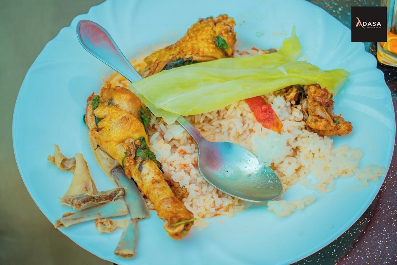 A plate with fried chicken, rice, and vegetables.