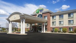 A hotel with a covered entrance, a brick facade, and a sign indicating it is a Holiday Inn Express. - Holiday Inn Express Kalamazoo (Kalamazoo)