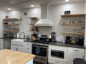 Coffee/tea maker, fridge, microwave, oven