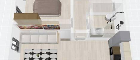 A floor plan of a hotel room with a bed, a sitting area with a sofa and a coffee table, a small kitchen area, and a bathroom.