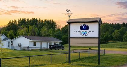 Enjoy a cozy stay in our Cabin Room at U.P. Trails Getaway