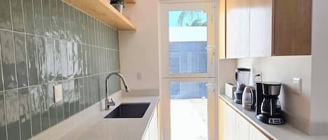 Coffee/tea maker, fridge, microwave, oven