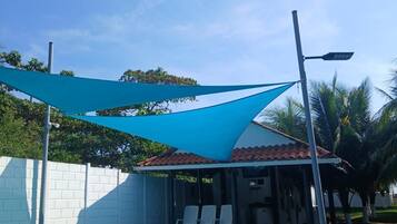 Outdoor pool, open 8:00 AM to 8:00 PM, pool umbrellas, sun loungers