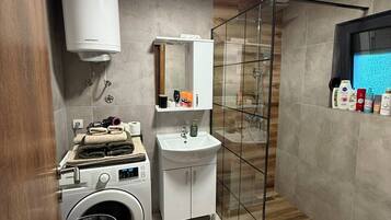 Shower, hair dryer, towels, soap