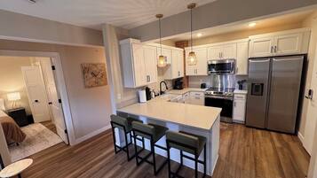 Coffee/tea maker, fridge, microwave, oven