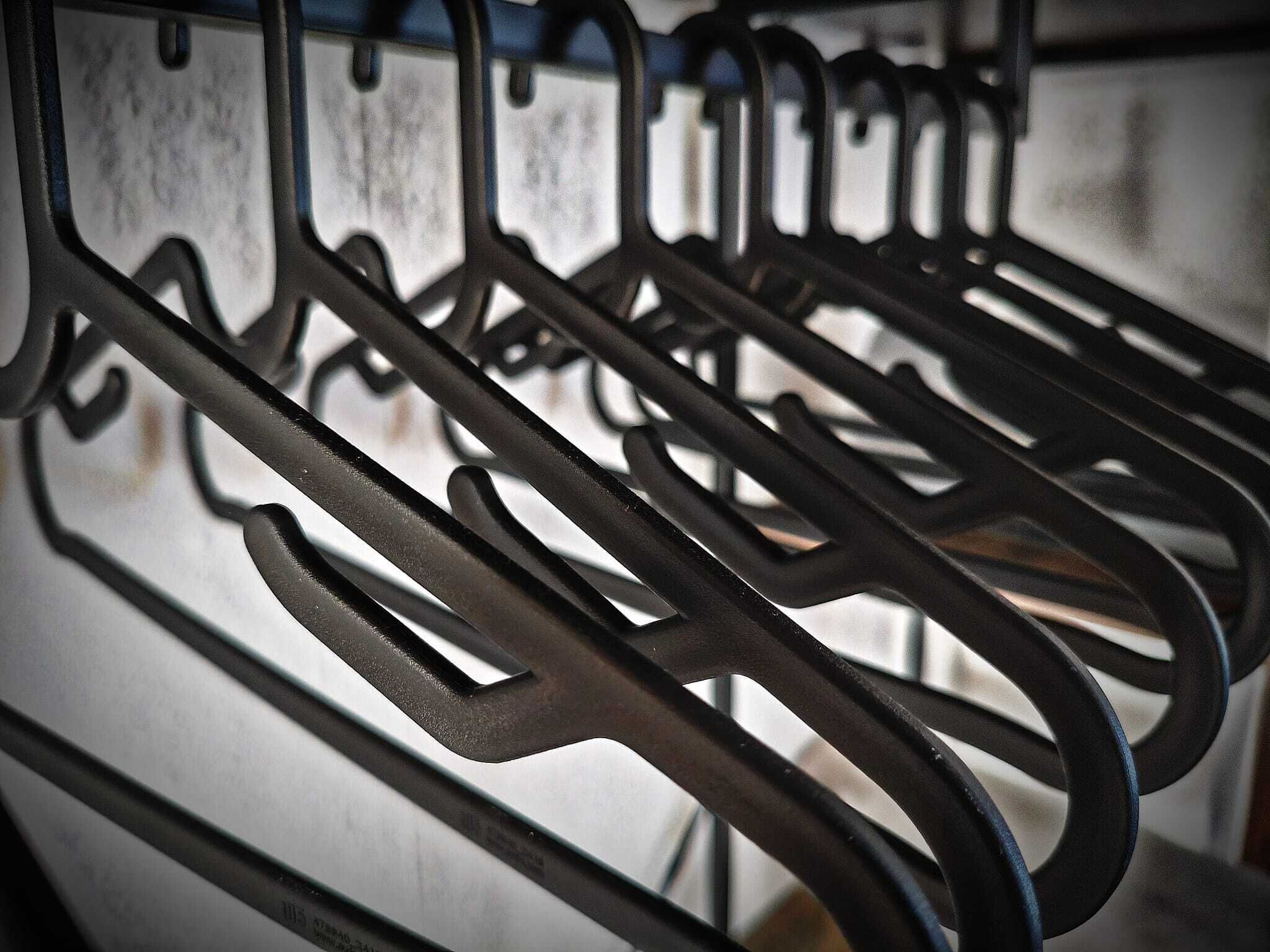 A metal rack with multiple hooks, likely for hanging items.