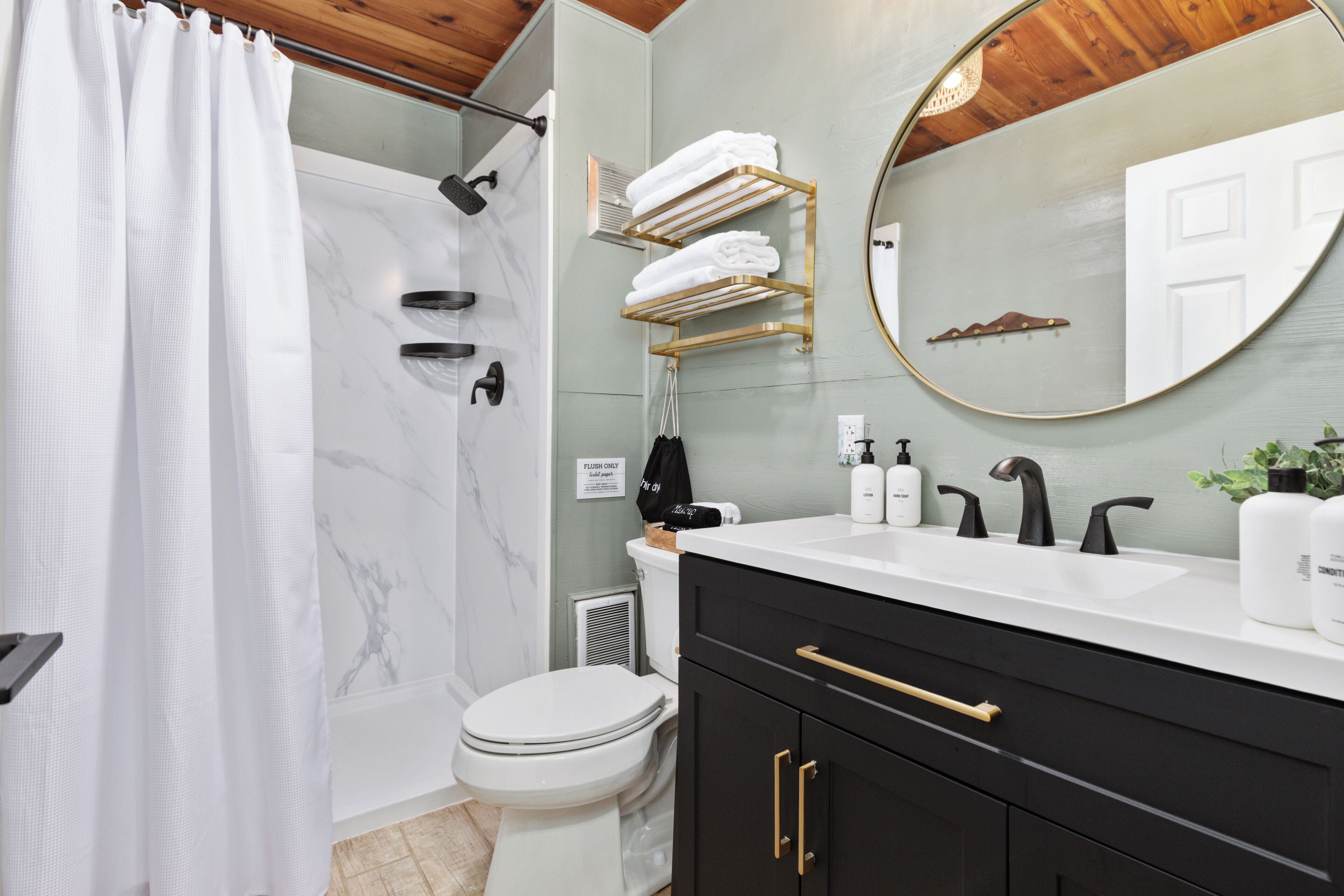 Hair dryer, towels, shampoo, toilet paper