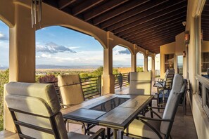 An outdoor patio with a table and chairs, a pergola, and a view of the landscape. - Stunning Tuscany Style Home, Breathtaking 360 Views + Casita! (Cottonwood)