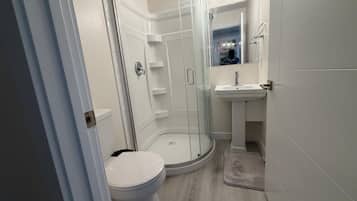 Shower, towels, soap, toilet paper