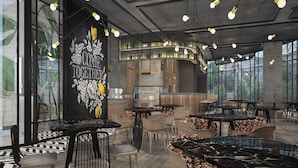 A modern restaurant interior with high ceilings, pendant lighting, and a central bar area. - Side Square Hotel - Adults Only (Manavgat)