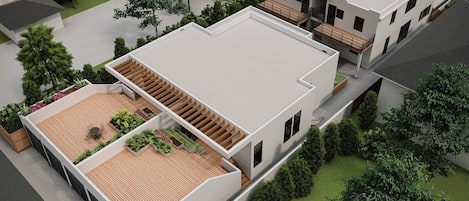 Un immeuble résidentiel moderne à deux étages, doté d’un toit plat, d’un patio couvert avec un plancher en bois et d’un jardin aménagé.