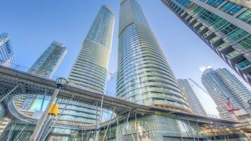 A modern high-rise building with a curved facade and multiple floors.