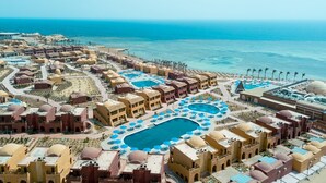 A resort with multiple swimming pools, beachfront villas, and a clear view of the ocean. - Pickalbatros Portofino Villaggio Resort (Marsa Alam)