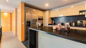 Coffee/tea maker, fridge, microwave, oven