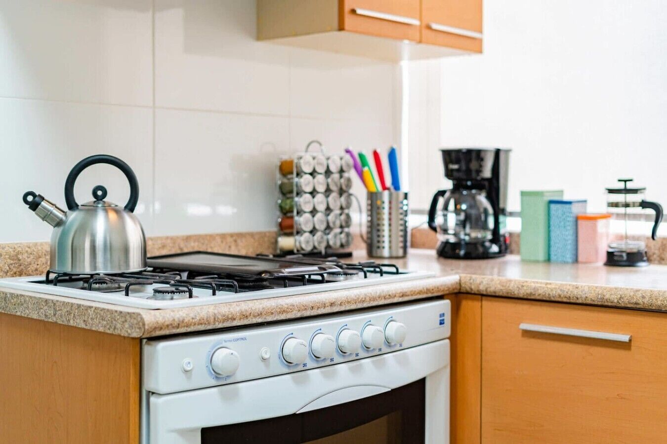 Coffee/tea maker, fridge, microwave, oven