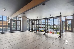 Achieve your fitness goals in our well-equipped modern gym area. - Bay-View High-Rise: Private Balcony, Pool & Gym (Miami)