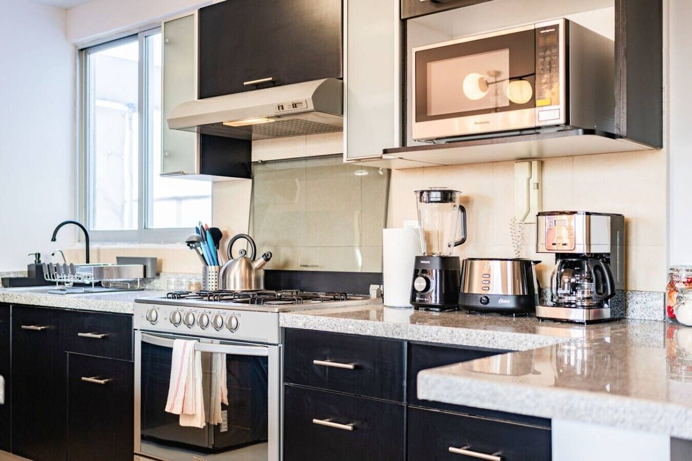 Coffee/tea maker, fridge, microwave, oven