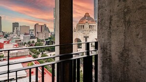 A cityscape with a prominent dome structure, high-rise buildings, and a balcony railing. - Stylish 1BR • Gym & Workspace • Near Reforma (Mexico City)