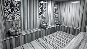 A bathroom with a marble floor, a large mirror, and a sink with a bowl. - Comfort Suites Hotel (Van)