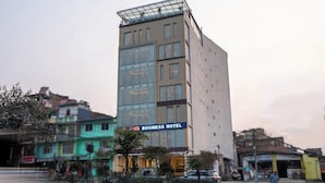 A multi-story building with a sign indicating it is a business hotel. - Apex Business Hotel (Kathmandu)