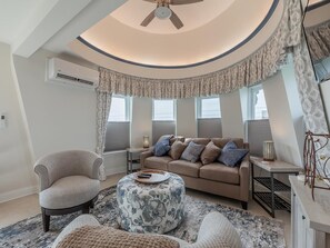 A living room with a sofa, armchairs, a coffee table, and a ceiling fan. - Jackson St. Penthouse Condo. Middle of Downtown. (Cape May)