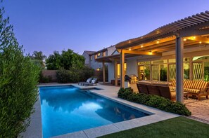 A swimming pool with lounge chairs and a barbecue area. - Luxury Gilbert + Game Room/Fire Pit*Heated Pool (Gilbert)