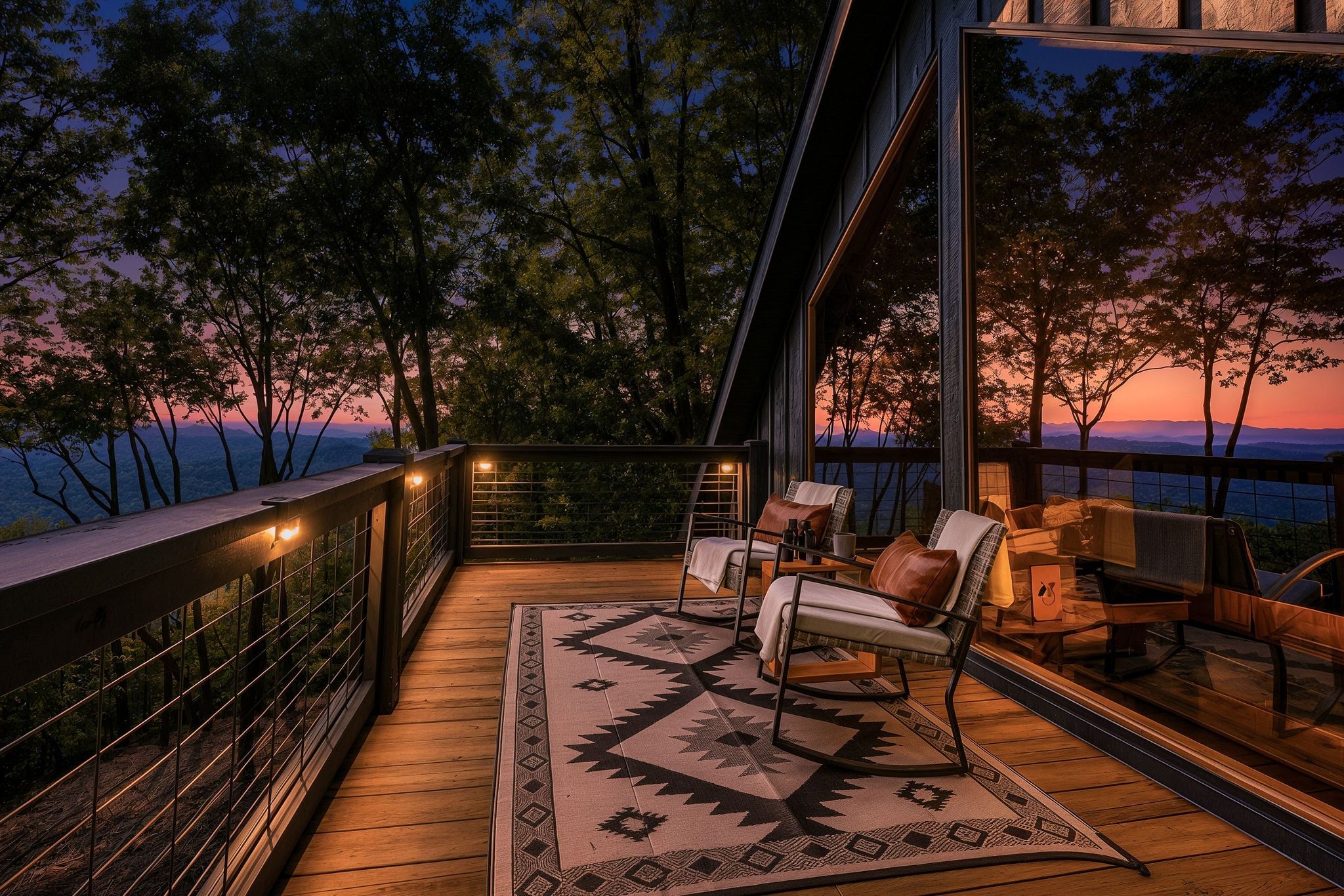 A deck with outdoor seating and a view of the landscape.