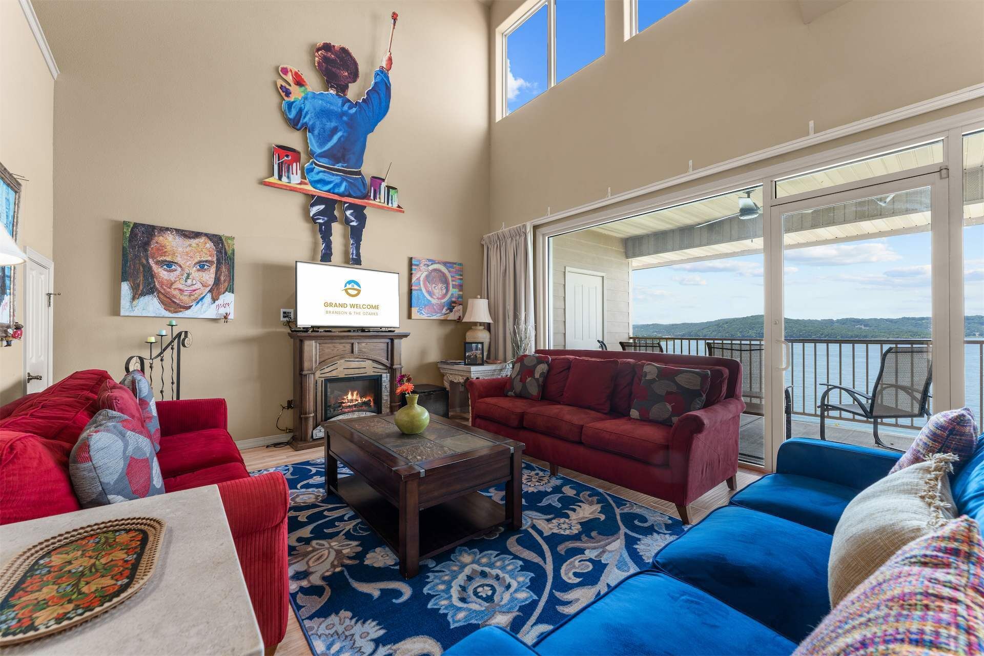 A living room with a fireplace, a television, and a sofa.