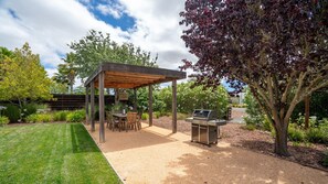 An outdoor patio with a pergola, a grill, and a dining table with chairs. - Private Pool | East Sonoma | By Homewood Winery | 2BR, Sleeps 4, Quiet Street (Sonoma)