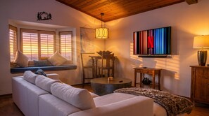 Smart TV, fireplace, books, stereo