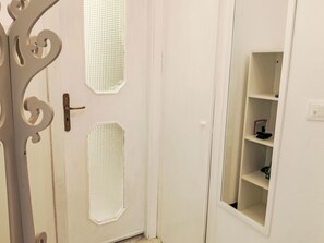A white door with decorative cutouts and a metal handle. - Onda Blu House by Interhome (Loano)