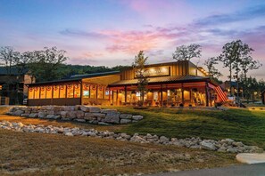 A building with a sign that reads 'GENERAL STORE' and a covered outdoor seating area. - More than a getaway, your best Branson family vacation memories start right here! (Hollister)