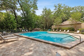A rectangular swimming pool with a 3 ft 6 in depth sign, surrounded by lounge chairs and a brick patio. - Peaceful Plantation 2BR; Fairway Oaks (Fernandina Beach)