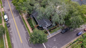 An aerial view of a residential property with a house, a driveway, and a street. - Parkside 1922 - Steps to Boone Park & Avondale Shops (Jacksonville)
