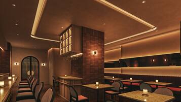 A restaurant interior with booths, tables, and a bar area.