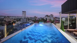 A rooftop infinity pool with a city view at dusk. - Grand Sol Luxury Boutique Hotel (Hanoi)