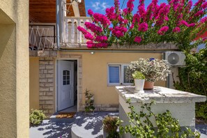 A residential building with a balcony, a door, and a window. - Zadar App Klaric 1 with Garden, Zadar, Croatia (Zadar)