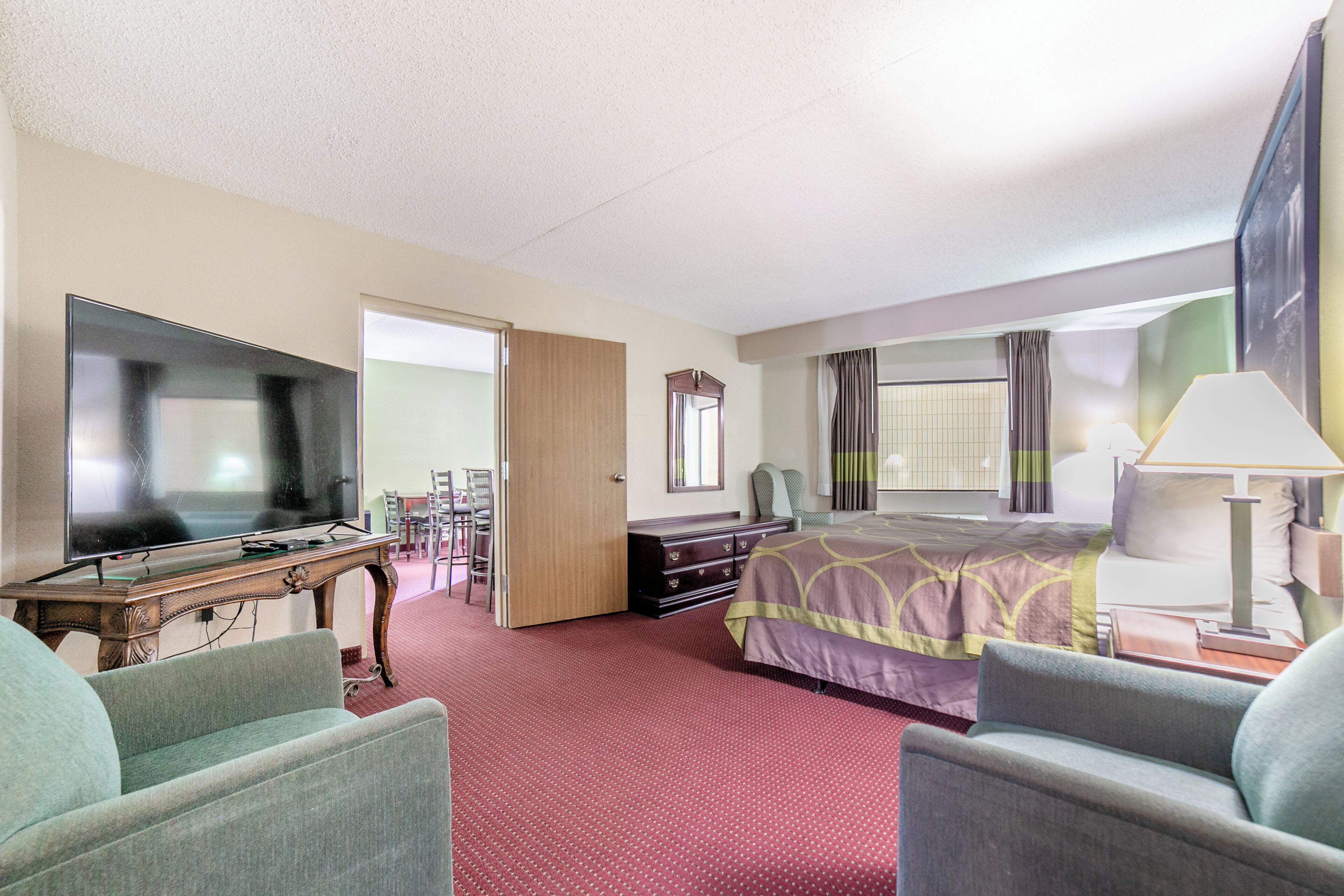 Suite | Desk, laptop workspace, blackout drapes, iron/ironing board