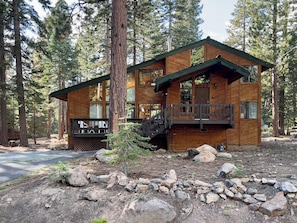 A wooden cabin with a balcony, surrounded by trees. - Pinecone Paradise Chalet-Dog Friendly Walk to Lake (Carnelian Bay)