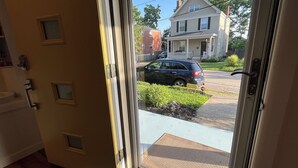 A door leading to a porch with a view of a street and a house. - Hyde Park "Rail Trail" Entire House (Cincinnati)