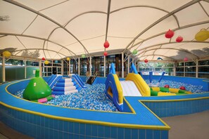 An indoor play area with a ball pit, slides, and inflatable structures. - Empark Grand Hotel Kunming (Kunming)