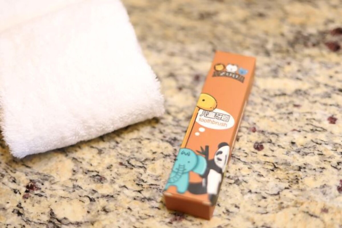 A box of soap with cartoon characters on a granite countertop.