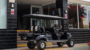 A hotel entrance with a sign reading 'HOTEL COSTA DEL SUR' and a golf cart parked outside. - Hotel Costa del Sur (Ilo)
