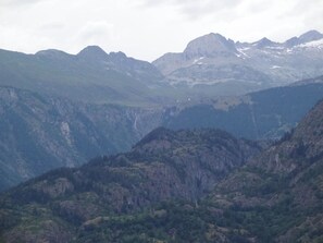 A mountainous landscape with rugged terrain and dense forests. - Wohnung Bergruh Appartement/Fewo, Dusche, WC 2-Bettwohnung by Interhome (Rosswald)