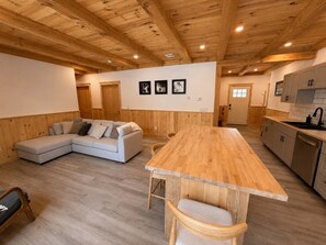 A modern kitchen with wooden cabinets and a central island. - Bear Hearth | Nordic Barn, Stowe Nature Escape (Stowe)