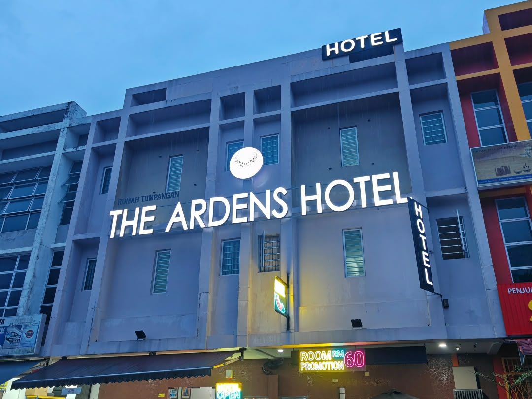 A hotel building with a sign that reads 'The Ardens Hotel.'