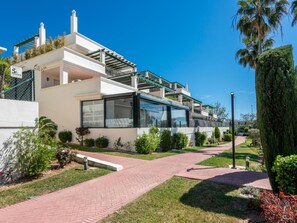 A modern two-story house with a covered patio, a paved driveway, and well-maintained landscaping. - Locrimar Family Apartment With Amazing Location (Marbella)