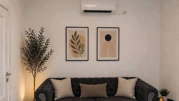 A modern living room with a dark sofa, a glass coffee table, and two framed artworks on the wall. - Luxury Stay in the City Center (Bucharest)