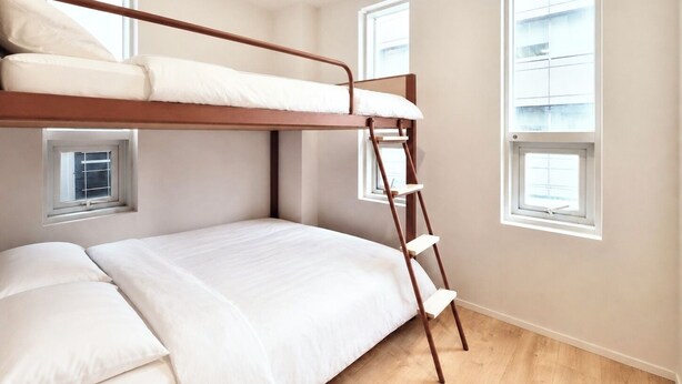 A bunk bed room with a ladder, two windows, and a wooden floor. - Susu House (Seoul)