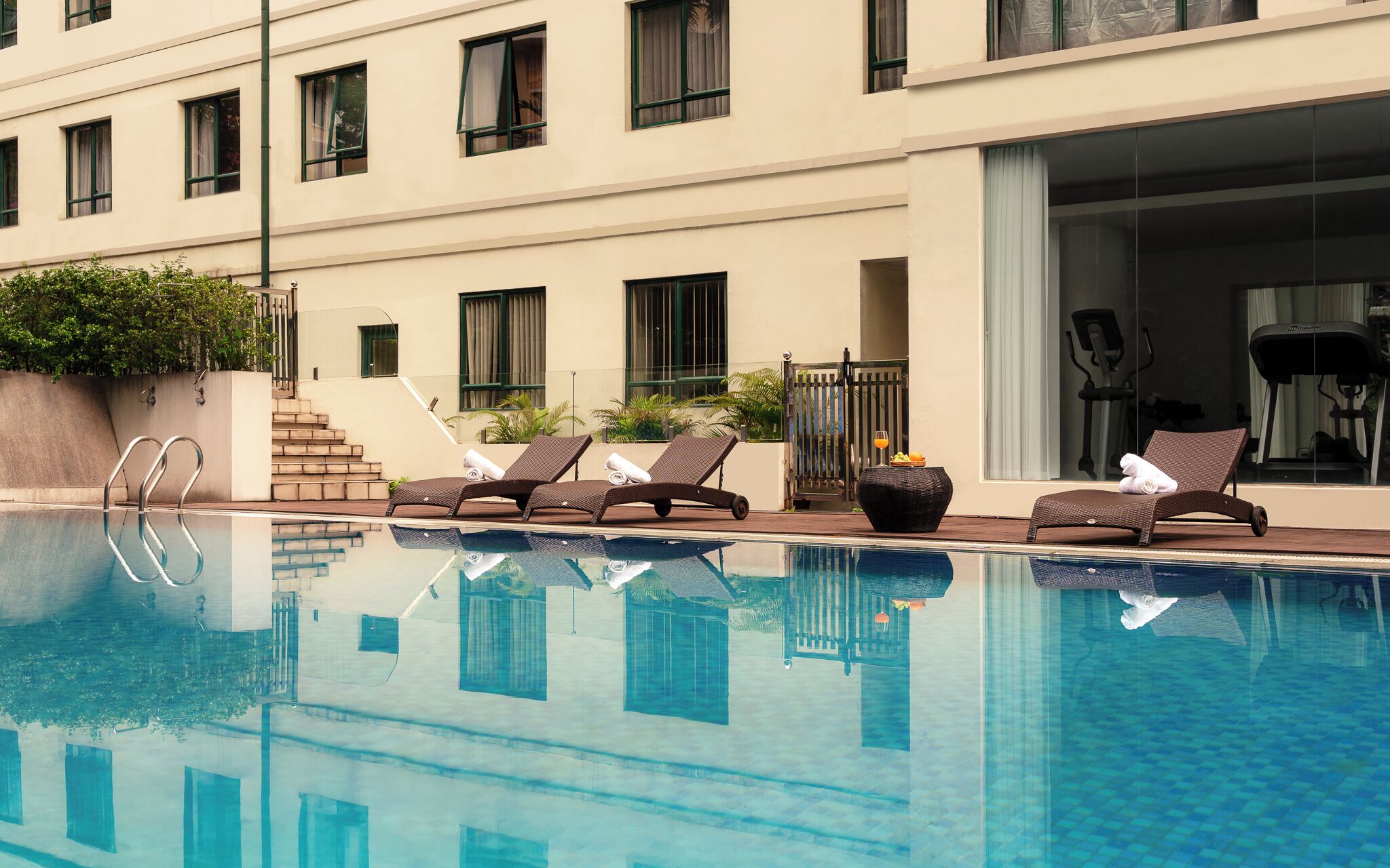 Outdoor pool, open 6:00 AM to 10:00 PM, pool loungers
